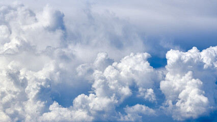 White porous clouds on the blue sky, cloudy landscape.