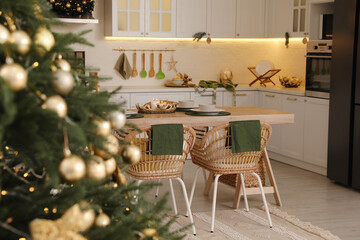 Beautiful Christmas tree in spacious kitchen, closeup. Space for text