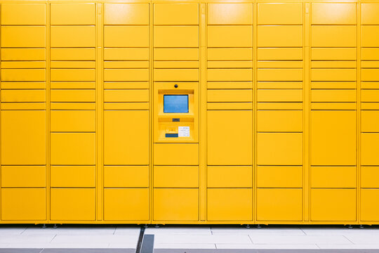 Yellow locker with screen and scanner for storage of packages purchased online. Messaging concept, compare online, e-commerce and packages