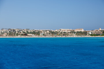 Fototapeta na wymiar Hurghada, Egypt. . Buildings, swimming pools and a recreation area by the red sea.