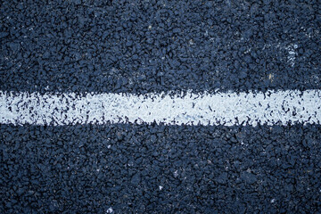 Fototapeta premium New asphalt road surface with white line