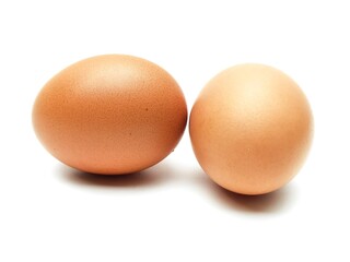 Close-up photo of fresh organic chicken eggs from farm on white background.