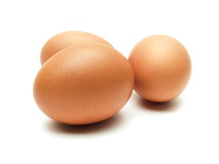 Close-up photo of fresh organic chicken eggs from farm on white background.