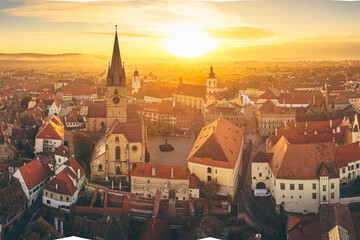 Aerial view over Sibiu city in Transylvania, Romania, during an amazing sunset over the centre old...