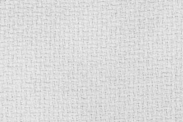 White natural texture of knitted wool textile material background. White crochet cotton fabric woven canvas texture. close up