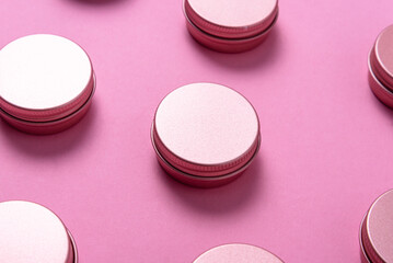 Set of tin metal boxes, cases. on pink background