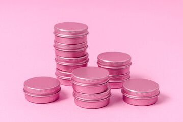 Set of tin metal boxes, cases. on pink background