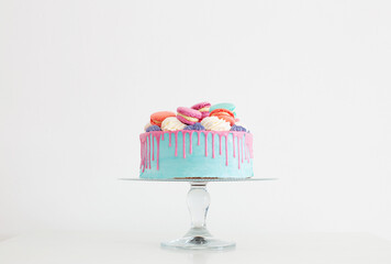 piece of cake with pink and blue decor on white background