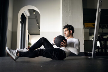 Fototapeta na wymiar A man healthy lifestyle athlete does the right exercises cardio workout in the gym. Fitness concept