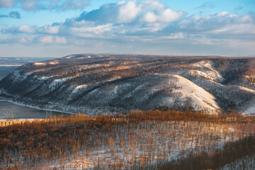 Amazing winter landscape in the mountains, top view. The snow lies on the mountains and the trees are covered with ice. Russia, Togliatti
