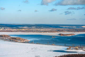 Beautiful winter snowy landscape and views of the city of Togliatti, the Volga River and the hydroelectric power station. Top view