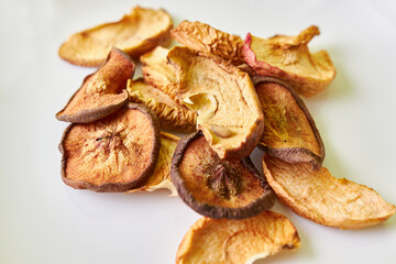 Dried fruits. Dried apples and pears on a white background.