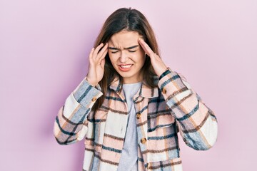 Young caucasian girl wearing casual clothes with hand on head, headache because stress. suffering migraine.