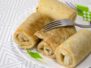 Spring rolls on a white plate