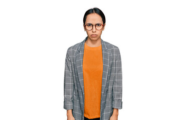 Fototapeta premium Young hispanic girl wearing business jacket and glasses skeptic and nervous, frowning upset because of problem. negative person.