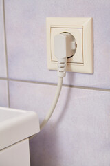 Electrical plug in socket close-up
