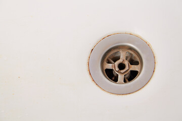 Metallic water drain in bathroom
