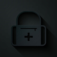 Paper cut First aid kit icon isolated on black background. Medical box with cross. Medical equipment for emergency. Healthcare concept. Paper art style. Vector