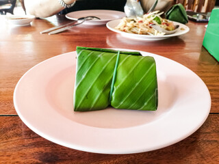Thai food. Sticky rice wrapped in banana leaves