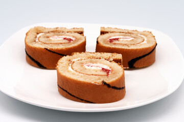 Sliced roll on a plate.