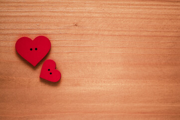 red hearts on wooden surface