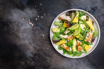 pineapple salad, grilled chicken breast, avocado, green rocket salad, lime and olive oil, sesame and seeds. banner, menu recipe place for text, top view