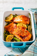 baked salmon fish fillet with asparagus and lemon