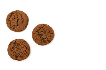 Three chocolate chip cookies on a white background top view. Three round chocolate chip cookies lined in a triangle with empty space for text