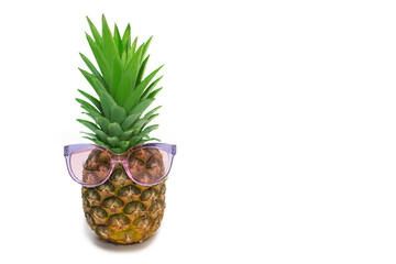 Pineapple in sunglasses on a white background. Ripe juicy pineapple in sunglasses. Pineapple in the form of a male face with fashion accessories with free space for text