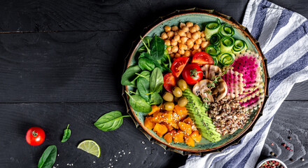 Buddha Bowl with Quinoa, Avocado, mushrooms, cucumber, chickpeas, spinach, tomatoes, vegetables salad. Clean eating, dieting, vegan food concept. top view