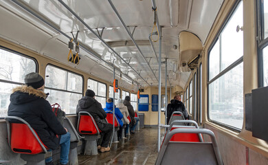 Passengers in the cabin of the Kiev tram Tatra-T3