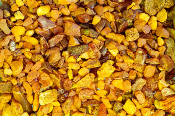 Jewelry made of amber. Natural amber on the table.