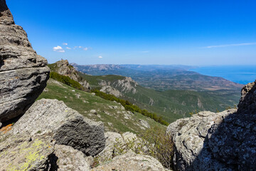 The Valley of Ghosts. Demerji. Green trees and bushes in the foreground. Crimea.