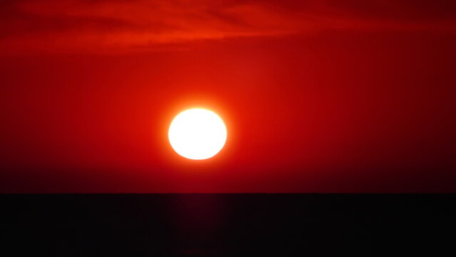 red sunlight over the sea at sunset © Anatolii 