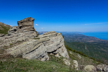 The Valley of Ghosts. Demerji. Green trees and bushes in the foreground. Crimea.