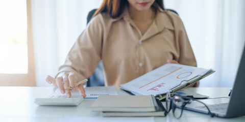 Business woman working to analyze technical price graph and indicator. account or saving money or...