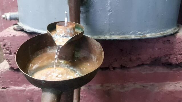 Home production of alcohol on flame fire. Alcohol, rakia distillation equipment.