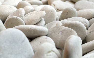 the nature texture of the white gravel stone. surreal objects photographed for a background collection. rough pattern of the mineral surfaces.
