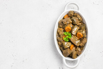 Turkey liver carrot  in ceramic dish. Top view, copy space.