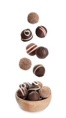 Delicious sweet chocolate truffles falling into wooden bowl on white background