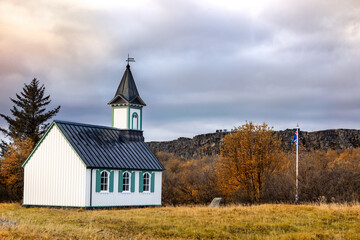 Fototapeta na wymiar Pingvellir Church in the Pingvellir National Park, southwest Iceland in autumn This chapel in set in the valley between two volcanic fault lines.