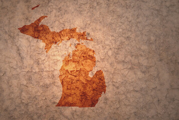 map of michigan state on a old vintage crack paper background
