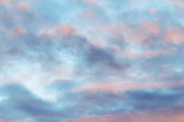 Clouds in the sky are illuminated from below by the light of the sun. Beautyfull sky wallpaper and background. Sunset or sunrise scene at dusk.