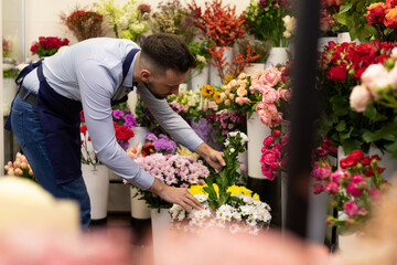 a florist among the flowers in the refrigerator cleans up the upcoming sales for International Women's Day