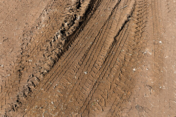 Tyre track on dirt sand or mud, retro tone, grunge tone, drive on sand, off road track