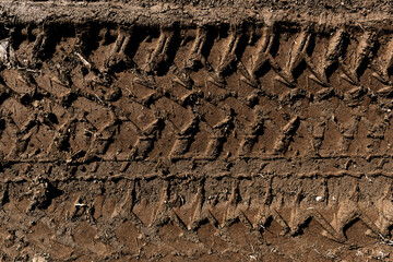 Tyre track on dirt sand or mud, retro tone, grunge tone, drive on sand, off road track