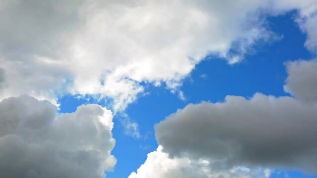 Blue sky with white cumulus clouds. Banner. Background. Nature wallpaper. Sunny weather forecast. Religion concept. Heaven landscape. Outdoor scenic. Bright pattern design. Copy space. Fresh air.