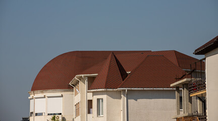 detail of roof of the house against blue sky