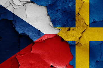 flags of Czechia and Sweden painted on cracked wall