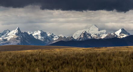 White mountain range seen from the puna of Conococha, with great plains and imposing snowy mountains of the Andes - obrazy, fototapety, plakaty